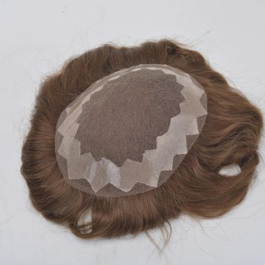 Close-up image of a brown hair wig on a white surface, showcasing texture and detail.
