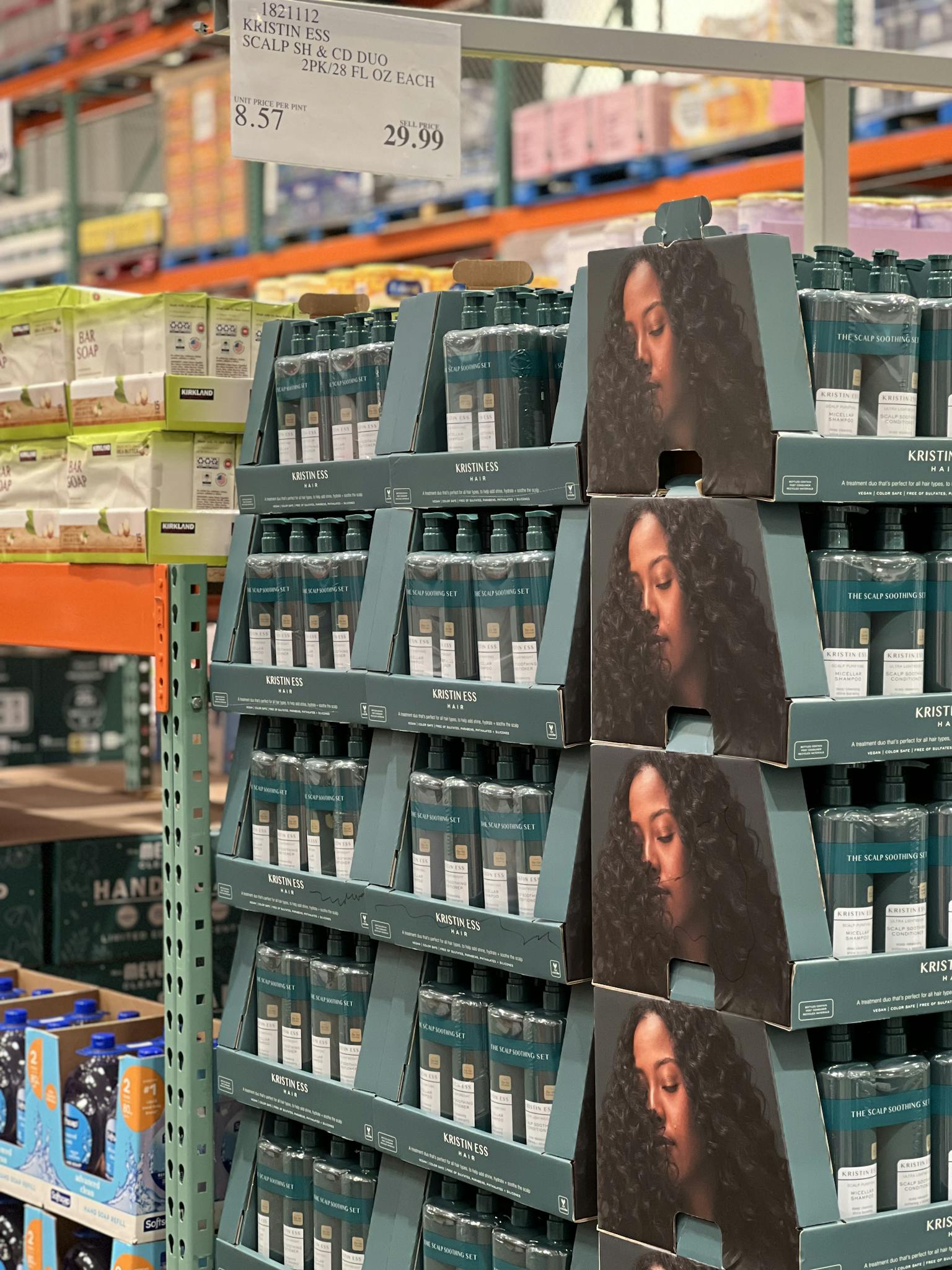 Organized display of hair care products in a retail store aisle.